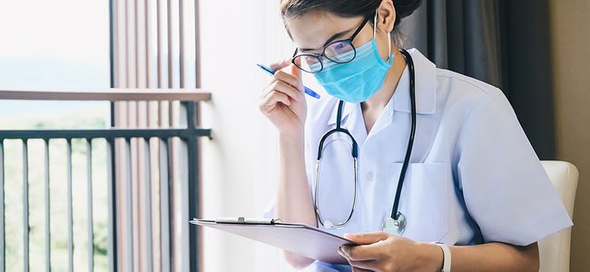 Nurse Reviewing Patient Chart