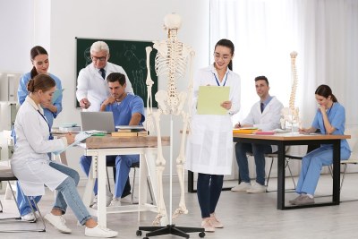 Groupof nursing students sitting in a classroom enrolled in a nurse educator program in Massachusetts.