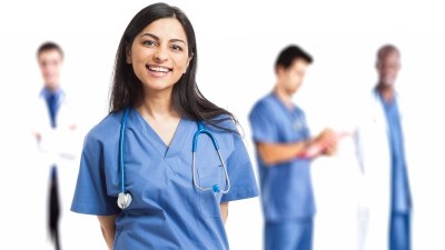 Nursing students in blue scrubs preparing for a PMHNP program in Arizona.