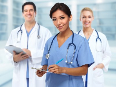 Smiling nursing students in scrubs enrolled in one of the best ADN programs Arizona.