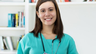 Nurse smiling after graduating from one of the cheapest RN to BSN online programs